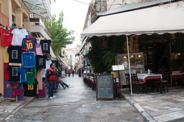Athens street with shops and restaurants clipart