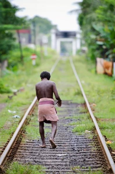 Unidentified asian man on railway lines. — Stock Photo, Image
