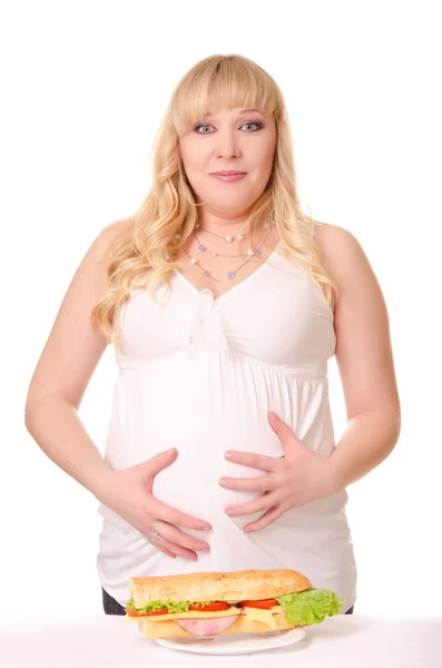 Emotional pregnant woman with huge sandwich — Stock Photo, Image