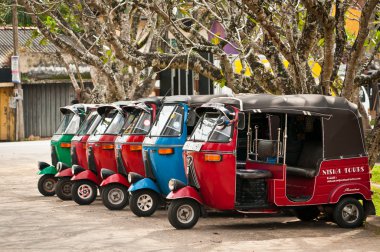 Tuk-tuk is a popular asian transport as taxi. clipart