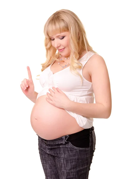 Mujer embarazada enseñar a un bebé en su vientre — Foto de Stock