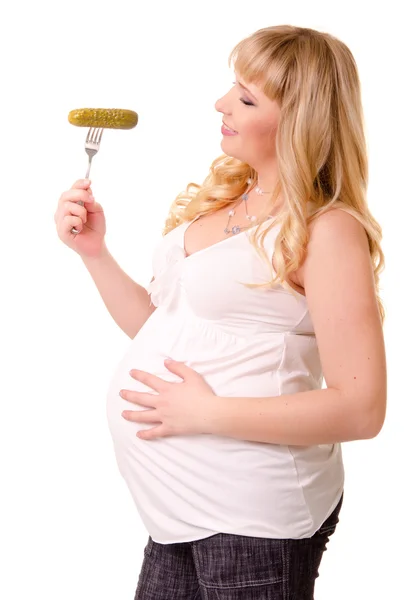 Pregnant woman with preserved cucumber — Stock Photo, Image