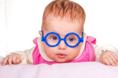 Portrait of funny baby with glasses clipart