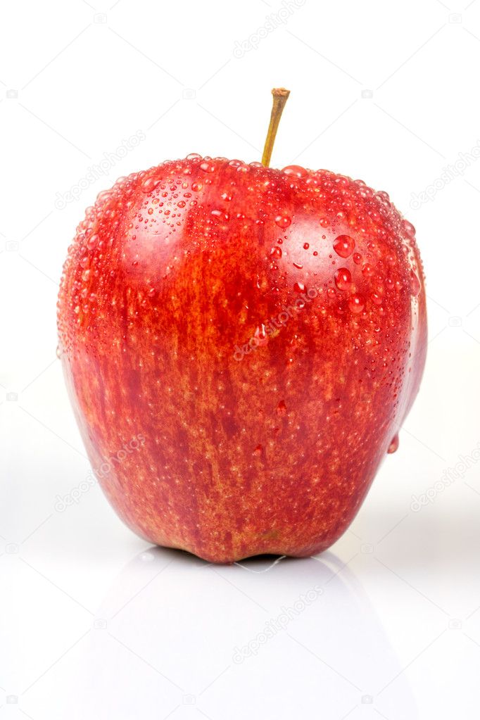 Wet red apple isolated on white