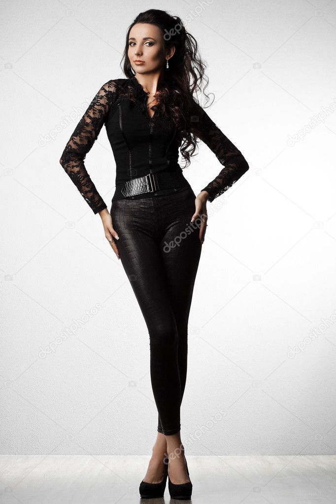 Beautiful fashionable woman in black clothes
