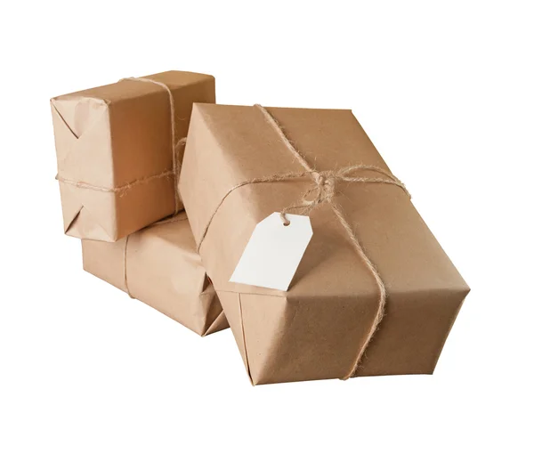 Pile parcel wrapped with brown kraft paper isolated — Stock Photo, Image
