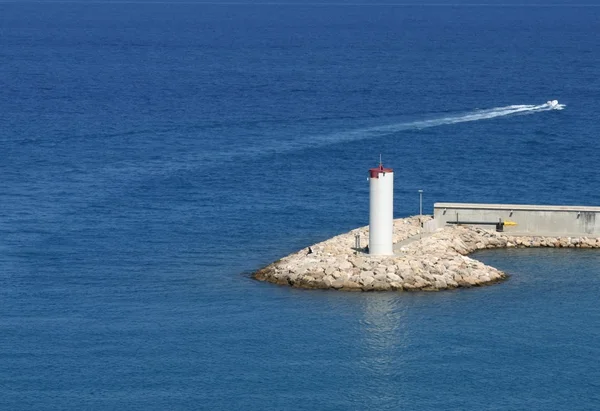 Lighthouse in the blue sea — Stock Photo, Image
