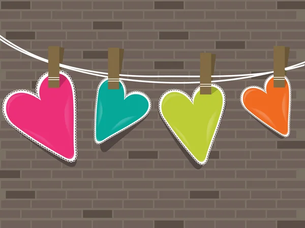 Coeurs colorés suspendus sur une ligne contre le mur  . — Image vectorielle