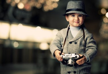 Baby boy with retro camera clipart