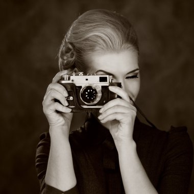 Woman in classic dress with retro camera clipart