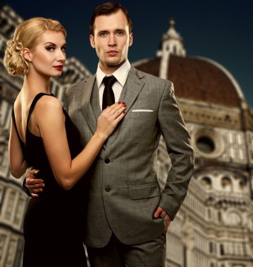 Retro couple against Duomo cathedral, Florence. clipart