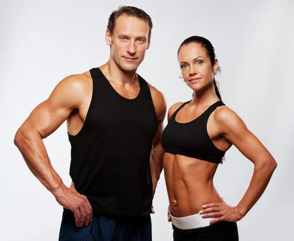 Atletisk man och kvinna — Stockfoto