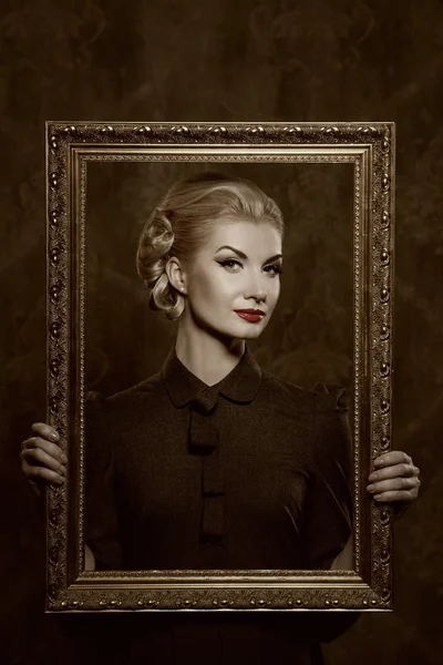 Retro woman with picture frame — Stock Photo, Image