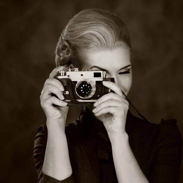 Woman in classic dress with retro camera — Stock Photo, Image