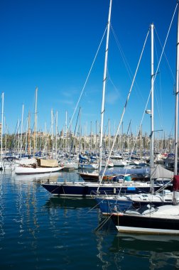 Yachts & boats in a harbour. clipart