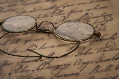 Old glasses on the vintage document clipart