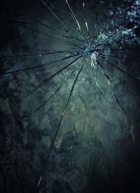 Broken glass over grey background. clipart