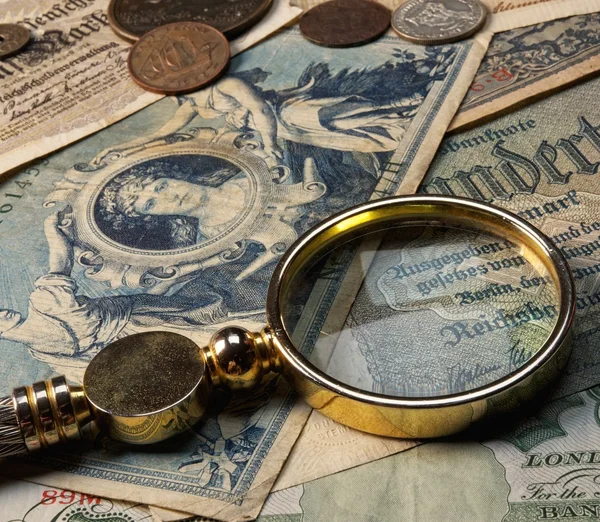 Old money with a lope on it — Stock Photo, Image