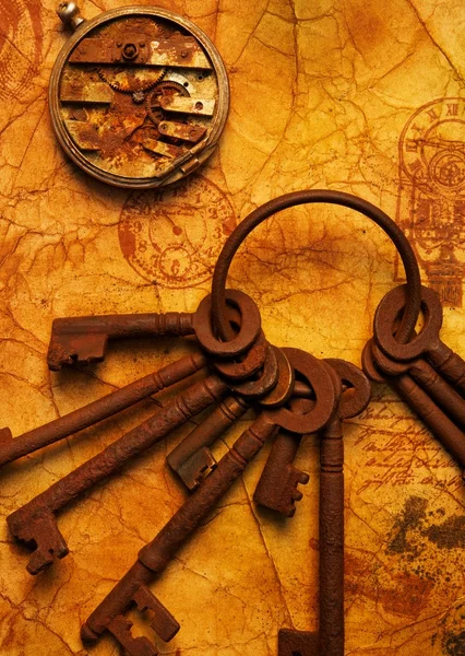 The old keys on the textured paper — Stock Photo, Image