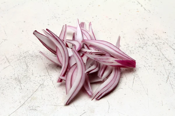 stock image Red onions on a chopping board