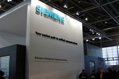 HANNOVER, GERMANY - MARCH 10: stand of Siemens on March 10, 2012 in CEBIT computer expo, Hannover, Germany. CeBIT is the world's largest computer expo. clipart