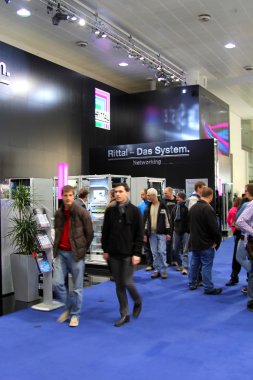 HANNOVER, GERMANY - MARCH 10, 2012: stand of the Rittal in CEBIT computer expo, Hannover, Germany. CeBIT is the world's largest computer expo. clipart