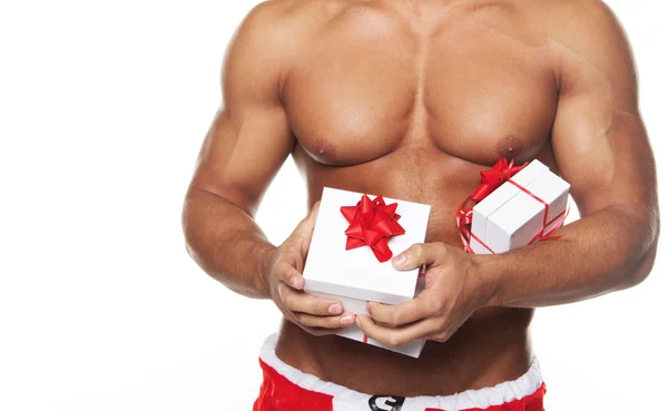Bodybuilders sexy body and xmas gifts — Stock Photo, Image