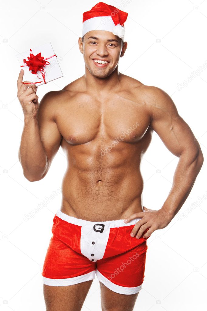 Image of sexy man wearing santa claus costume