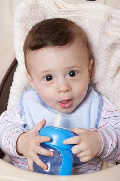 Adorable little baby boy with feeder — Stock Photo, Image