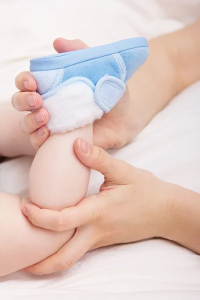 Image of little baby`s footstep with shoe — Stock Photo, Image