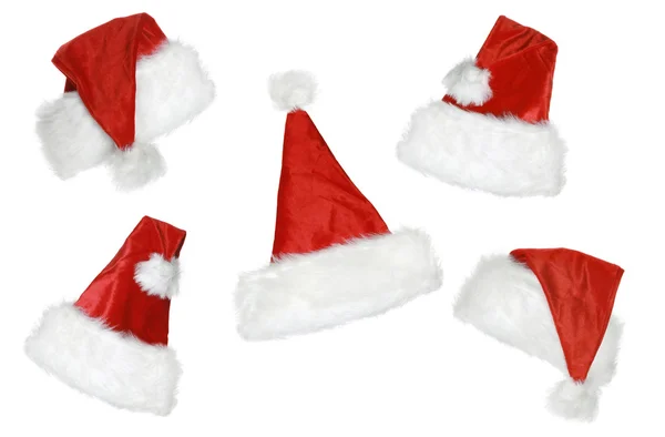 Рождественские шляпы на белом фоне — стоковое фото