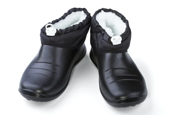 Zapatos femeninos de caucho negro —  Fotos de Stock