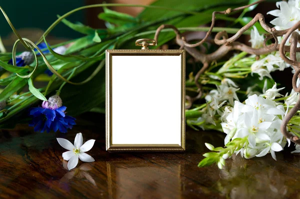 stock image Still life with antique frame with woman's portrait and flowers