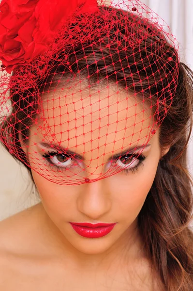 Beautiful woman in red hat with veil. — Stock Photo, Image