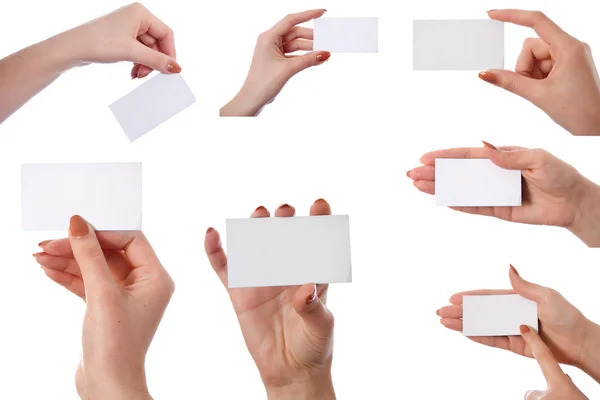 Набор рук с пустой визиткой — стоковое фото