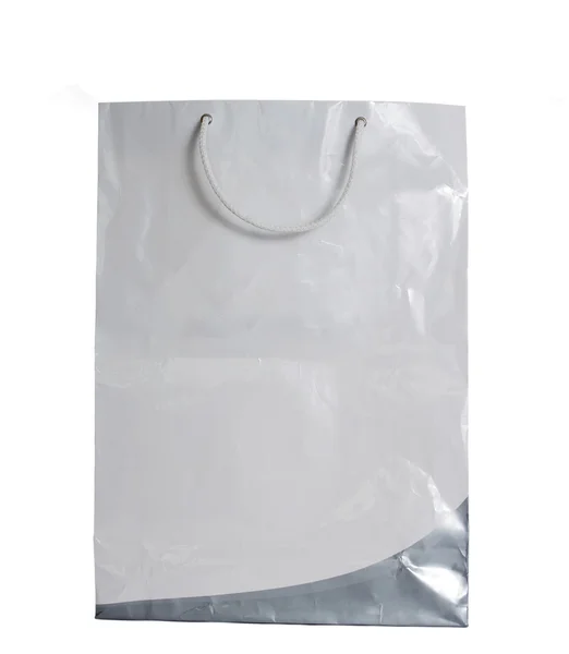 Bolso de papel blanco sobre fondo blanco con camino de recorte — Foto de Stock