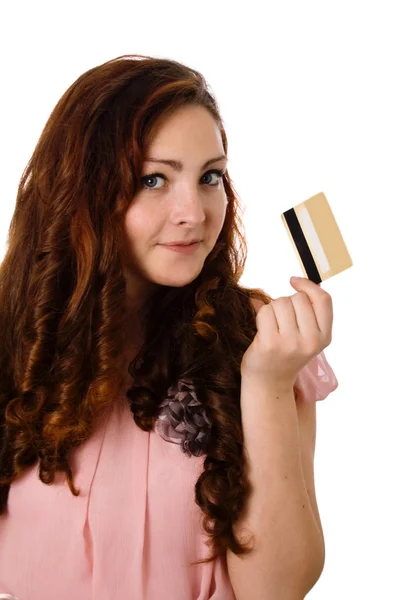 Hermosa chica sostiene una tarjeta de crédito bancaria Imágenes de stock libres de derechos