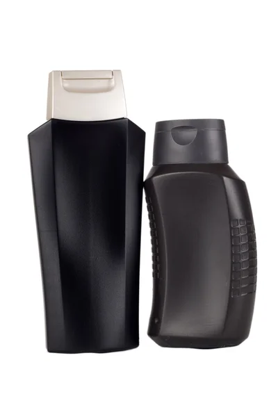 Twee zwarte plastic flessen — Stockfoto