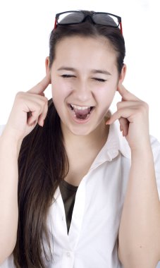 Young woman suffers from noise pollution, covers his ears. clipart