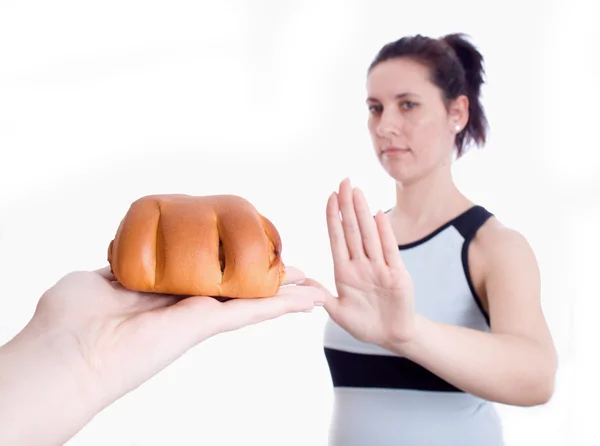 Vrouw weigert muffins geïsoleerd — Stockfoto