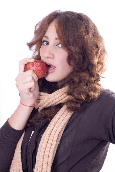 Young beautiful girl bites an apple. — Stock Photo, Image