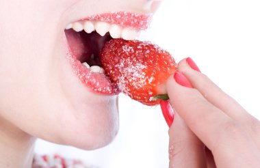 Woman eating a strawberry clipart