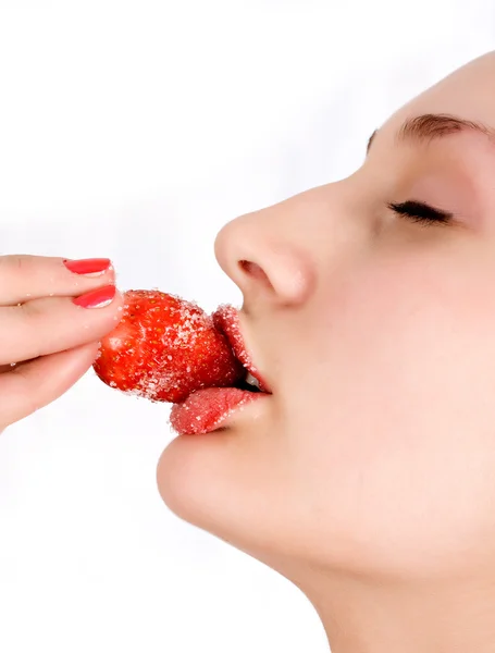 Young woman's mouth with red strawberry — Stock Photo, Image