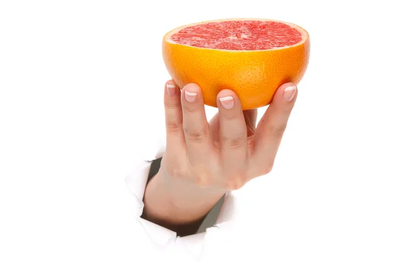 Рука с грейпфрутом — стоковое фото