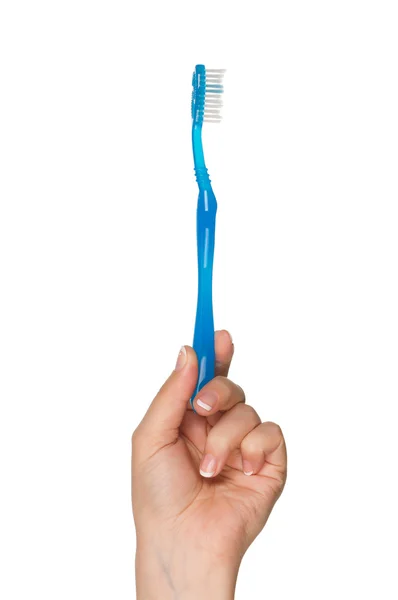 Mão com escova de dentes — Fotografia de Stock