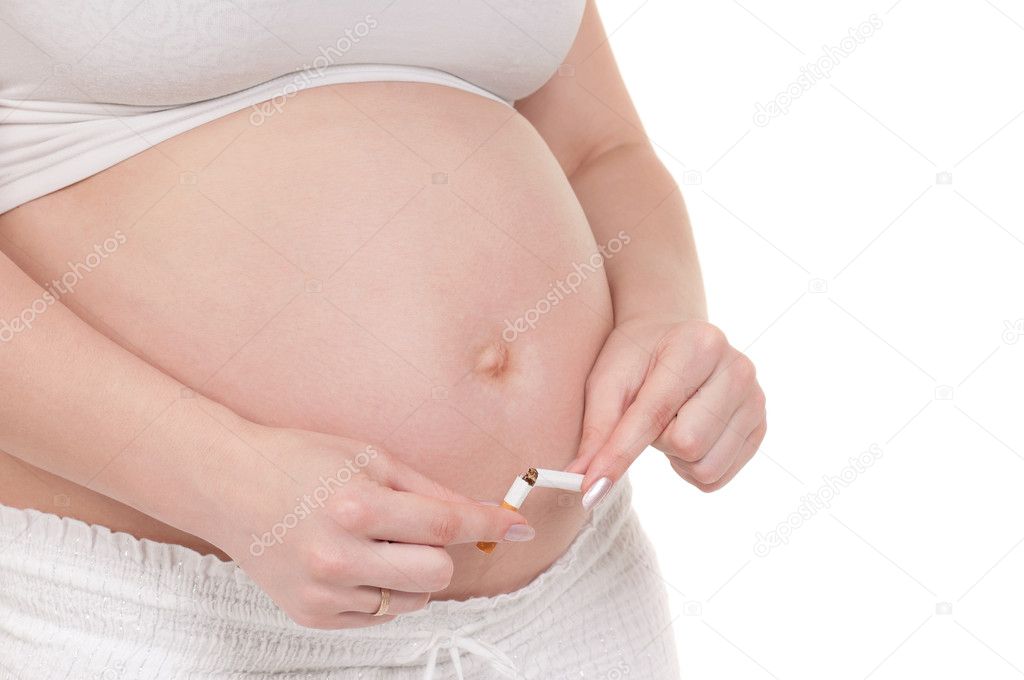 Pregnant belly with cigarettes