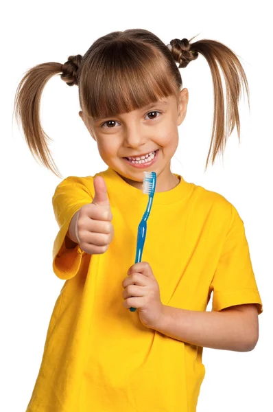 Menina com escova de dentes — Fotografia de Stock