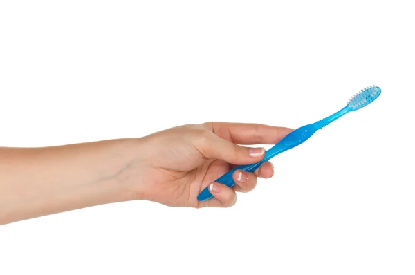 Mão com escova de dentes — Fotografia de Stock
