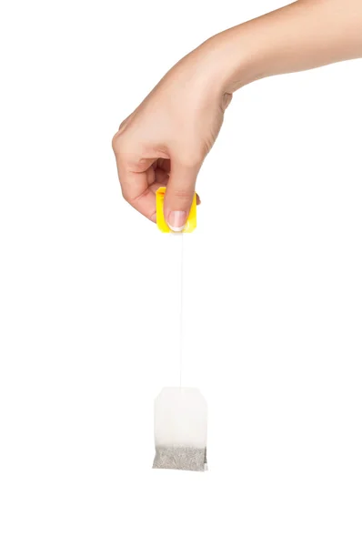 Hand with teabag — Stock Photo, Image