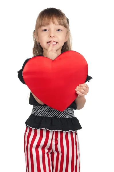 Klein meisje met rood hart — Stockfoto
